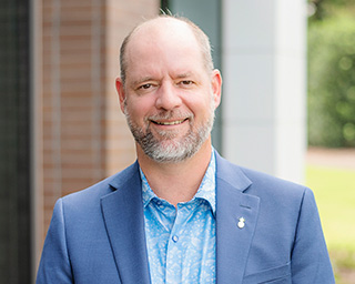 Headshot of John Compton Compton