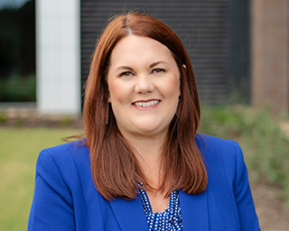 Headshot of Chief Compliance Officer, Stacy Fetterman.