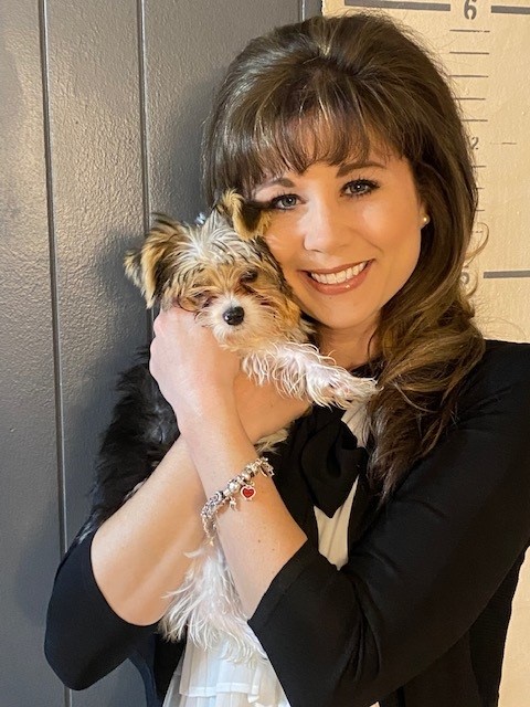 Heather Grant holding her puppy, Bentley.