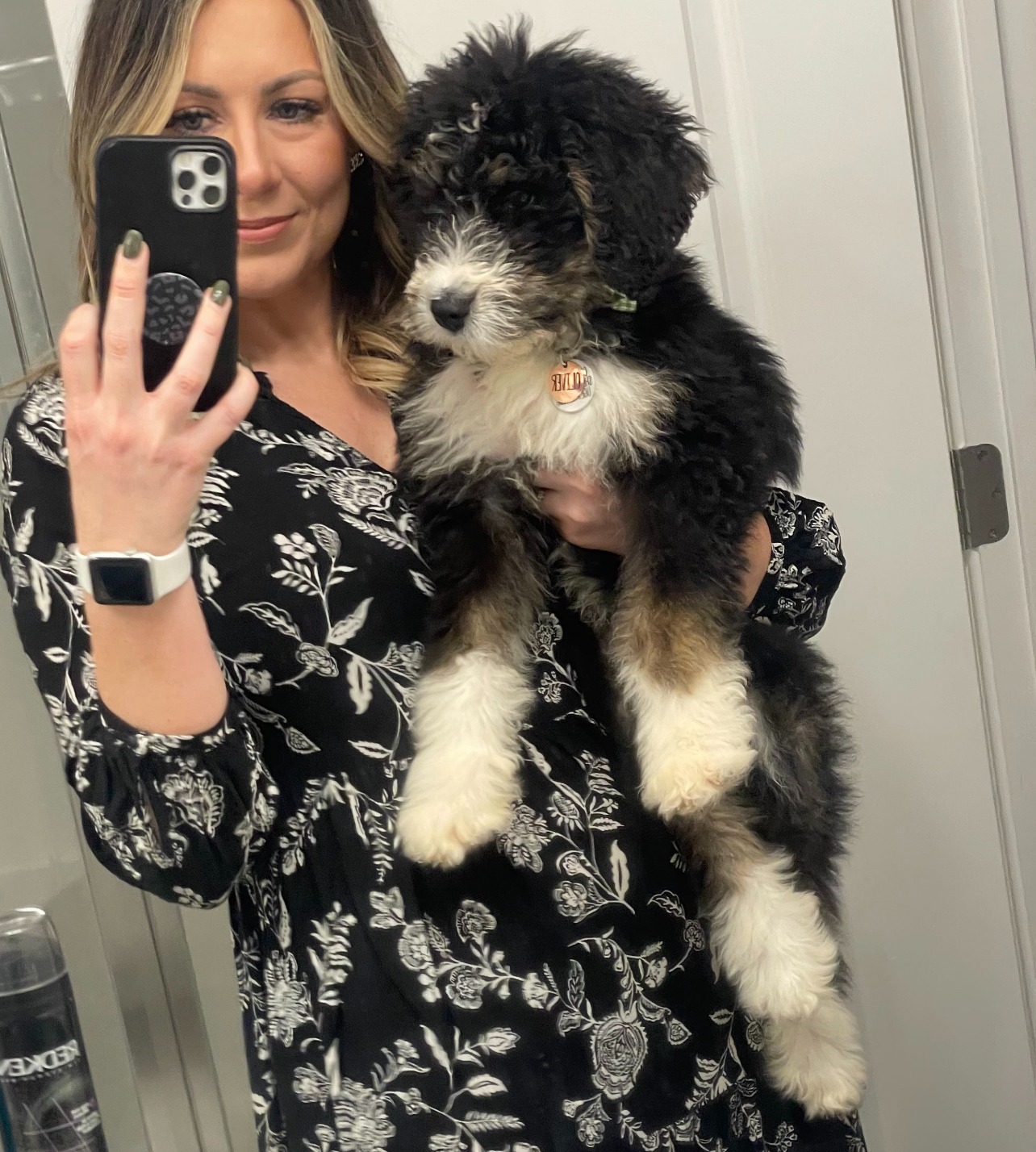 Ashleigh Featherstone holding her puppy, Oliver.