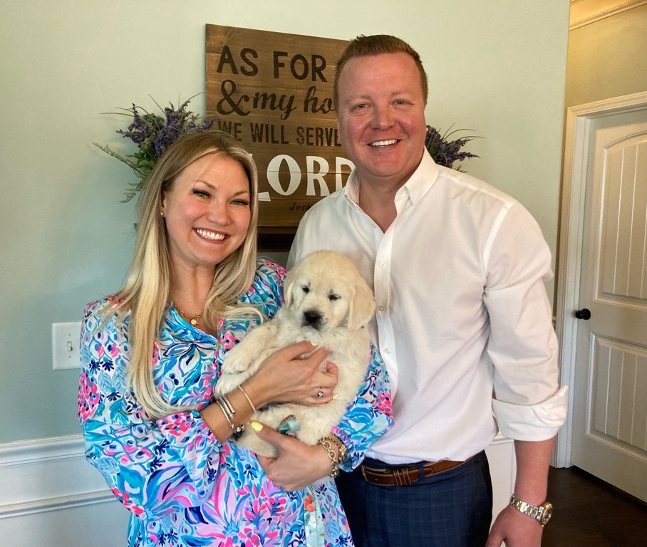 Daisy Mussetto and husband with new puppy, Lily.