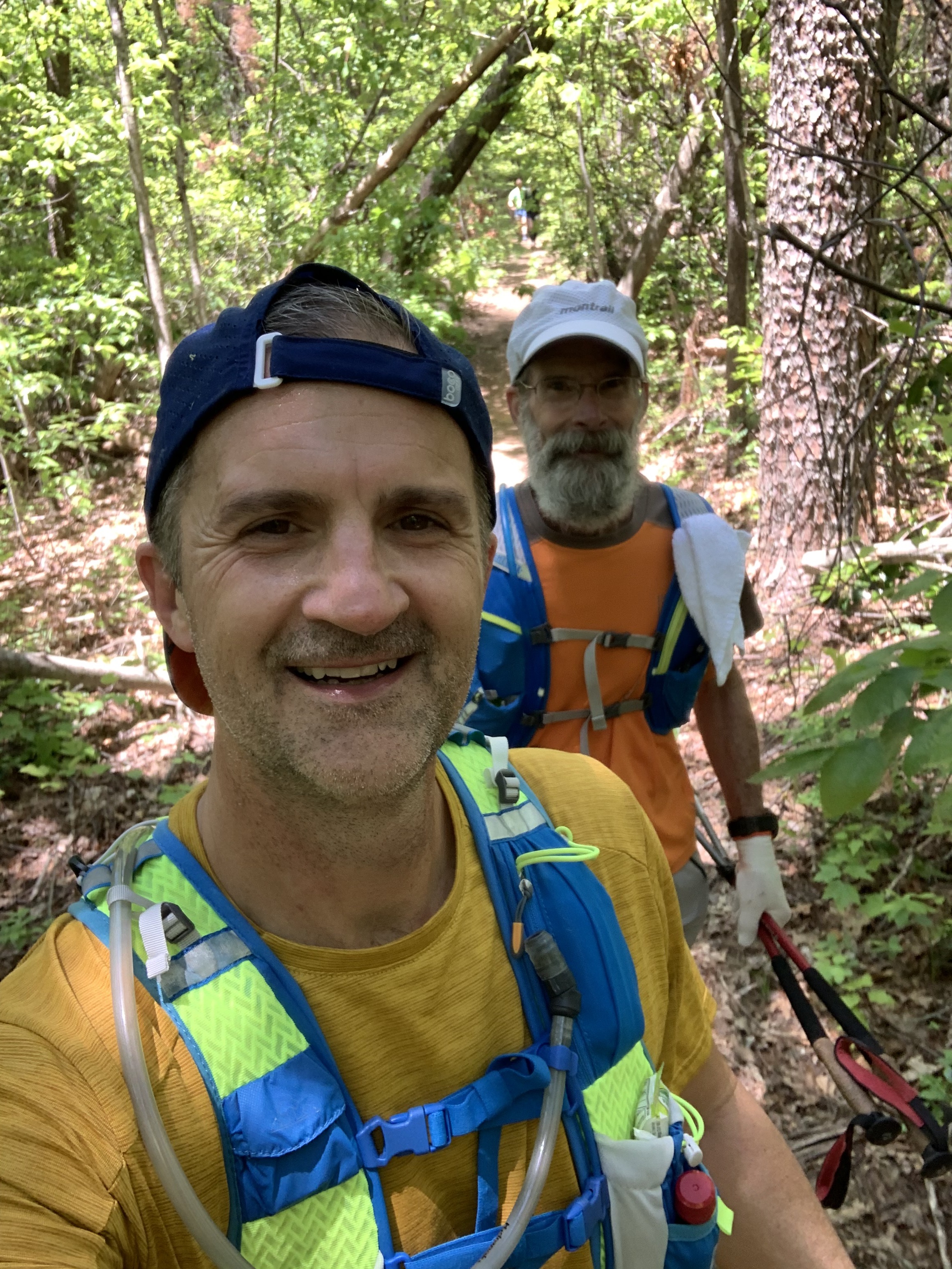 Selfie of Team Leader Michael Hopton and his father hiking on a trail.