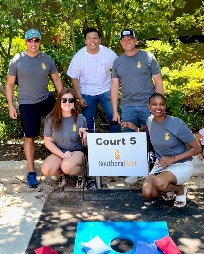 Southern First bankers at Haven House Services cornhole competition.